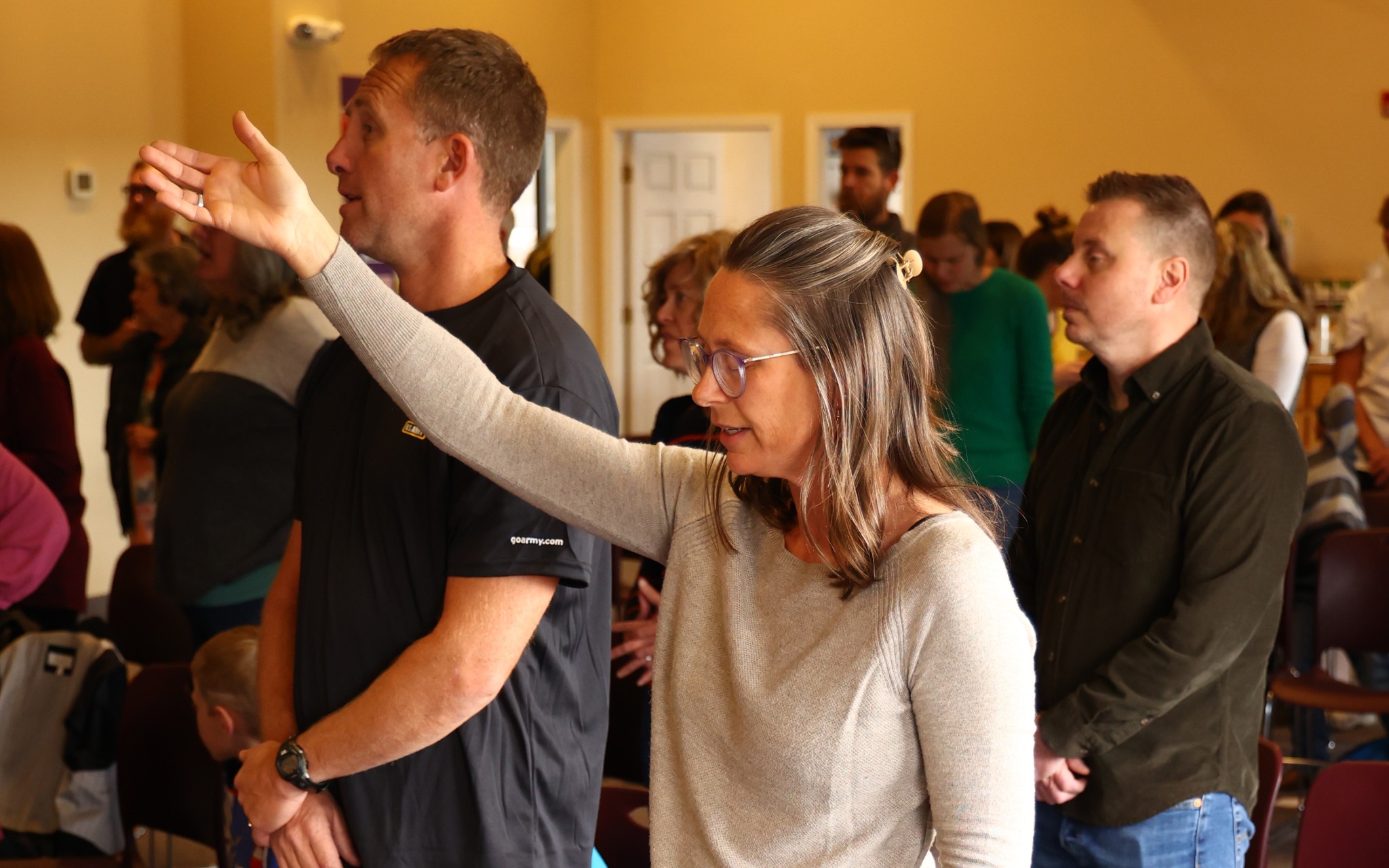 People participating in worship at The Anchor
